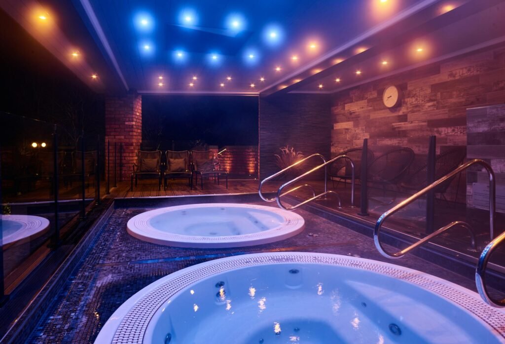 Two deck-level spa pools with access handrails at Fairlawns Hotel & Spa